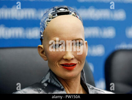 The humanoid robot Sophia speaks at a press conference in Kiev. The robot Sophia arrived to Ukraine to take part in the final of the all-Ukrainian competition of developers of robotics and artificial intelligence (AI) as jury member and meeting with Ukrainian Prime Minister Volodymyr Groysman. Humanoid robot Sophia was granted citizenship in Saudi Arabia, making her the first robot in the world to receive citizenship. Stock Photo