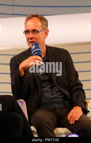 Frankfurt, Germany. 11th October 2018. German author Volker Kutscher speaks at a talk at the Frankfurt Book Fair. The 70th Frankfurt Book Fair 2018 is the world largest book fair with over 7,000 exhibitors and over 250,000 expected visitors. It is open from the 10th to the 14th October with the last two days being open to the general public. Stock Photo