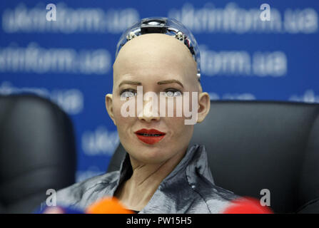 Kiev, Ukraine. 11th Oct, 2018. The humanoid robot Sophia speaks at a press conference in Kiev. The robot Sophia arrived to Ukraine to take part in the final of the all-Ukrainian competition of developers of robotics and artificial intelligence (AI) as jury member and meeting with Ukrainian Prime Minister Volodymyr Groysman. Humanoid robot Sophia was granted citizenship in Saudi Arabia, making her the first robot in the world to receive citizenship. Credit: Pavlo Gonchar/SOPA Images/ZUMA Wire/Alamy Live News Stock Photo