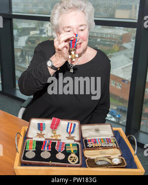 Glasgow, UK. 11th October 2018, Glasgow UK. Second World War Medals being presented to veteran's niece after going missing for decades. The Medals of Colonel William I French of the Glasgow highlanders were found in a safe of a Glasgow accountants four years ago, French Duncan.   Helen Woods (James Alexander French's grandaughter) presented with the medals. Credit: Colin Fisher/Alamy Live News