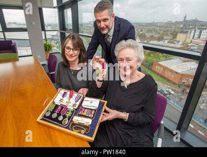 Glasgow, UK. 11th October 2018, Glasgow UK. Second World War Medals being presented to veteran's niece after going missing for decades. The Medals of Colonel William I French of the Glasgow highlanders were found in a safe of a Glasgow accountants four years ago, French Duncan.   Helen Woods (James Alexander French's grandaughter) presented with the medals. Credit: Colin Fisher/Alamy Live News