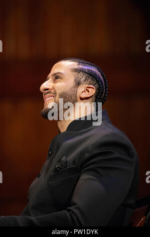 Hutchins Center, Harvard University, Cambridge, MA, USA. 11th Oct 2018. Colin Kaepernick during the 2018 W.E.B. Du Bois medal ceremony at Harvard University in Cambridge, Massachusetts, USA.   Kaepernick, a former NFL quarterback for  the San Francisco 49ers became an American icon after keeling during the U.S. National anthem in protest of Police violence against black Americans. Credit: Chuck Nacke/Alamy Live News Stock Photo