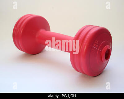 Pink 5KG Dumbbell isolated on a white background Stock Photo