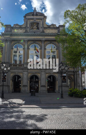 Buildings on Jan van Eyckplein square, Bruges, Belgium on a bright summer day with blue sky Stock Photo