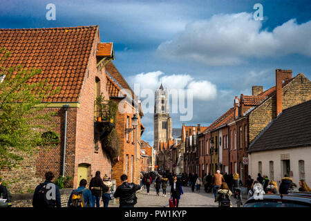 Bruge, Belgium - April 17 : Tourists walk towards the St. Salvator's Cathedral June 17, 2017 on a cloudy day during Stock Photo