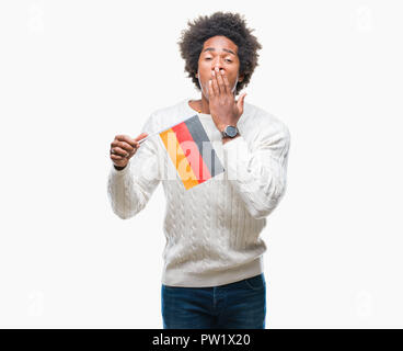 Afro american man flag of Germany over isolated background cover mouth ...