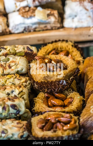 Almond and pistachio baklava snack called birds nest on display in bakery Stock Photo