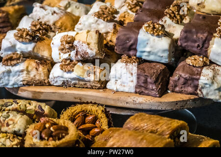 Walnut and chocoltae baklava snack on display in the supermarket bakery section Stock Photo