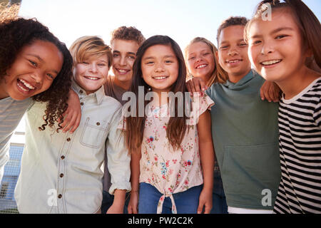 School kids hanging out during break, smiling to camera Stock Photo