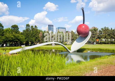 July 3, 2014, Minneapolis, USA - Red cherry on spoon in Sculpture Garden, Minnesota Stock Photo