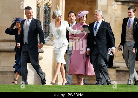 Robbie Williams (second left) arrives with his wife Ayda Field and other guests to attend the wedding for the wedding of Princess Eugenie to Jack Brooksbank at St George's Chapel in Windsor Castle. Stock Photo