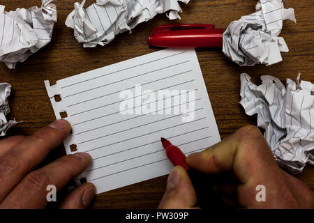 Design business concept Empty copy space modern abstract background. Man holding marker notebook page crumpled papers several tries mistakes Stock Photo