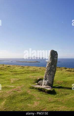View of an ancient obelisk ogham stone atop Dunmore Head on the Dingle Peninsula in County Kerry, Ireland Stock Photo