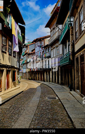 An afternoon street scene in the beautiful medieval town of Guimaraes in Northern Portugal. Stock Photo