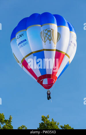 Pilot in cloudhopper hot air balloon in the sky at Longleat Sky Safari ...