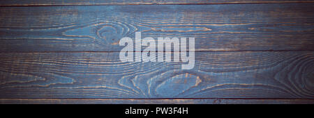 Background from wooden texture boards with remnants of blue and violet paint. Vignetting Stock Photo