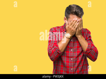 Young handsome man over isolated background with sad expression covering face with hands while crying. Depression concept. Stock Photo