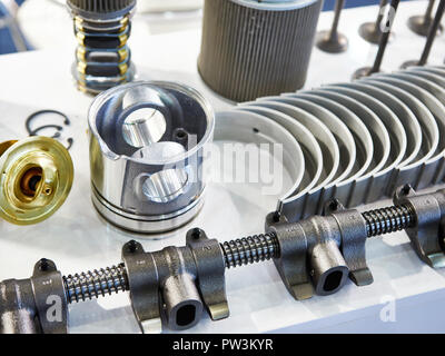 Details of the internal combustion engine on the store: piston, shaft, valves, inserts Stock Photo