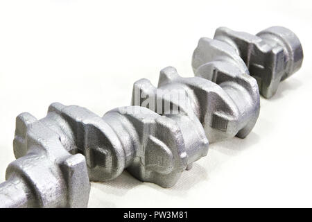 Stamped engine crankshaft on white Stock Photo