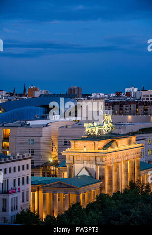 Berlin. Germany. Berlin skyline with elevated view of the  Brandenburg Gate (Brandenburger Tor) illuminated at night, and buildings on Pariser Platz,  Stock Photo