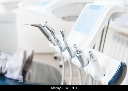 Different dental instruments and tools in a dentists office. Indoor Stock Photo