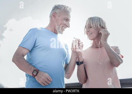 Positive delighted couple enjoying free time Stock Photo