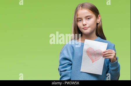 Young beautiful girl giving mother father day card with red heart over isolated background with a confident expression on smart face thinking serious Stock Photo