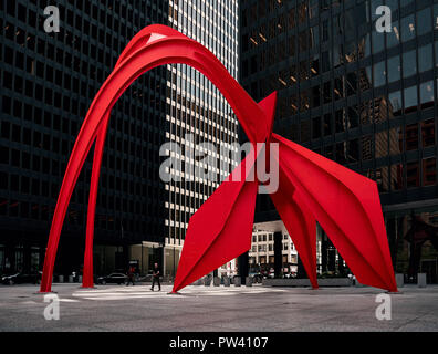 Calder's Flamingo sculpture in the middle of the vibrant public place, Federal Plaza, in Chicago, enclosed by high-rise office buildings