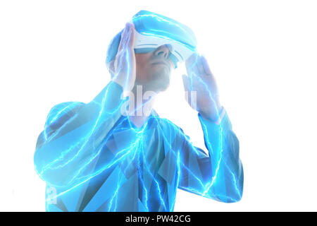 The man in the glasses of virtual reality. The concept of modern technologies and technologies of the future. VR glasses. Stock Photo