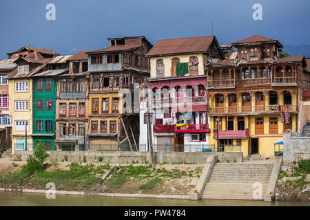 Srinagar, India - June 15, 2017: Riverside view of old town Srinagar from one of the bridges across Jhelum river, Jammu and Kashmir, India. Stock Photo