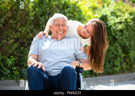 Portrait Of Happy Father And Daughter At Outdoors Stock Photo