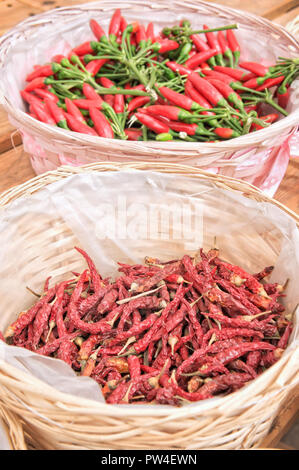 Red hot chili peppers on wooden table Stock Photo