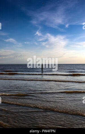 'Another Place' by Antony Gormley Iron Man statues on Crosby Beach Liverpool Merseyside Stock Photo