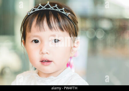 Little girl funny smiling face,portrait of joyful asian child adorable lovely looking at camera with smile Stock Photo