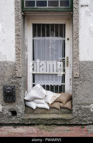 Protection against flooding at a front door in Rostock Stock Photo