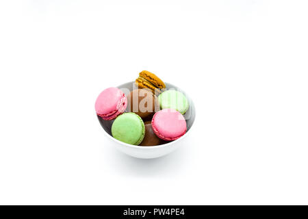macarons in bowl, sweet colorful macarons on white background Stock Photo