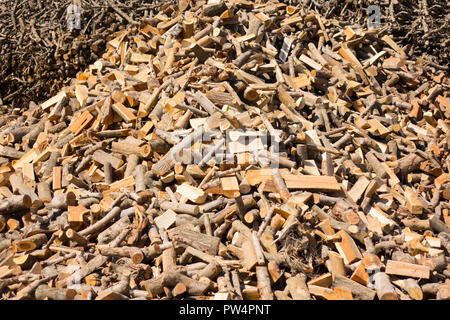 Punctured firewood in a pile against the background of a wood-burning barn Stock Photo
