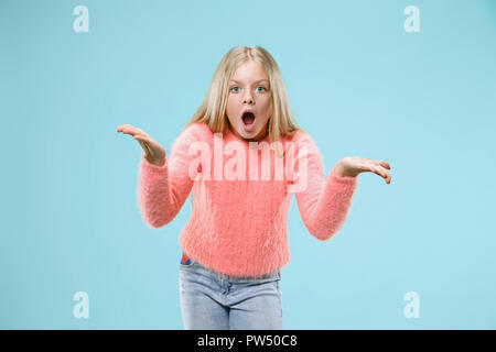 Argue, arguing concept. Beautiful female half-length portrait isolated on studio backgroud. Young emotional teen girl looking at camera. Human emotions, facial expression concept. Stock Photo