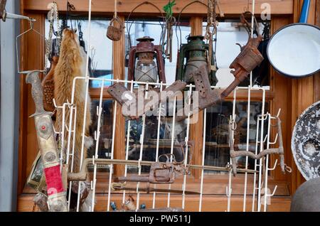 antique guns helmets and bric a brac outside gjirokaster shop albania Stock Photo