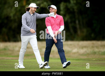 Tommy Fleetwood (left) and Francesco Molinari during day two of the British Masters at Walton Heath Golf Club, Surrey. Stock Photo
