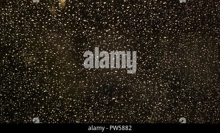 Rain Water Droplets on Glass Dark Background Stock Photo