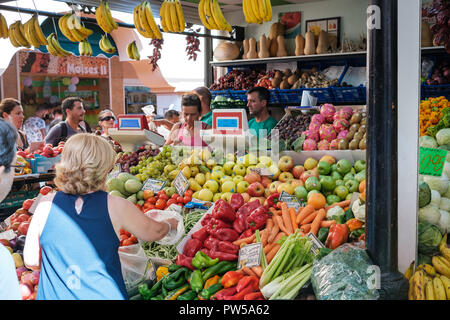 Santa Cruz de Tenerife, Canary Islands, Spain - September 2018: People buying fruits and vegetables at food market Municipal Market Our Lady of Africa Stock Photo