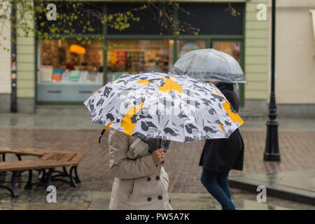 two umbrellas on a rainy street Stock Photo