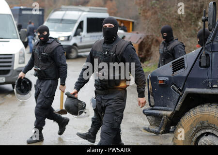 Special law enforcement unit. Special police force units in uniforms, bulletproof vests, firearms and guns. Masked police officers. Special Assault Te Stock Photo