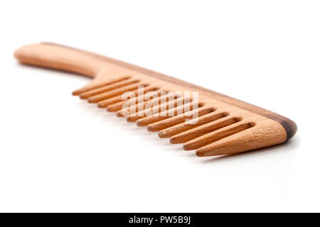 Wooden comb on a white background Stock Photo