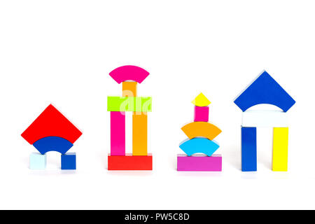 Children's multi-colored wooden blocks cubes toys on a white background. Multicolored figures. Stock Photo