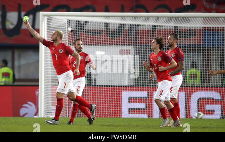 Austria's Marko Arnautovic (left) celebrates scoring his side's second goal of the game during the UEFA Nations League match at the Ernst Happel Stadium, Vienna. Stock Photo