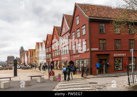 BERGEN, NORWAY - 05 MAY 2013: Famous Bryggen street with wooden colored houses in Bergen Stock Photo
