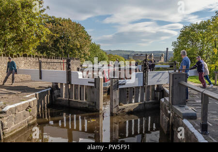 Opening lock gates at the top of Bingley Five Rise Locks, Yorkshire. Stock Photo