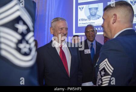 Secretary of Defense Jim Mattis interacts with audience members before ...